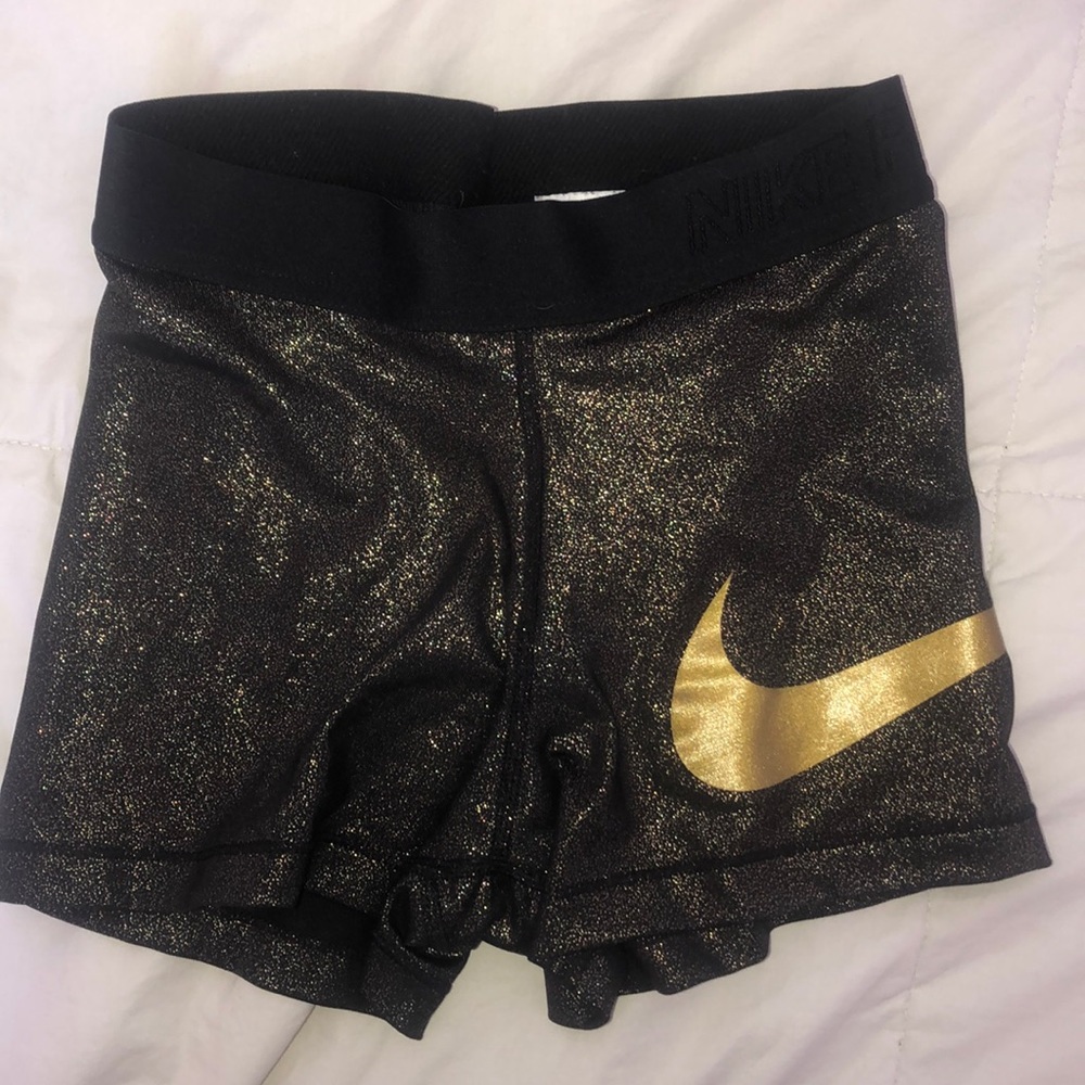 Gold sparkly Nike pros